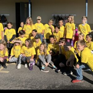 group of Vichy students in their yellow jog-a-thon t-shirts